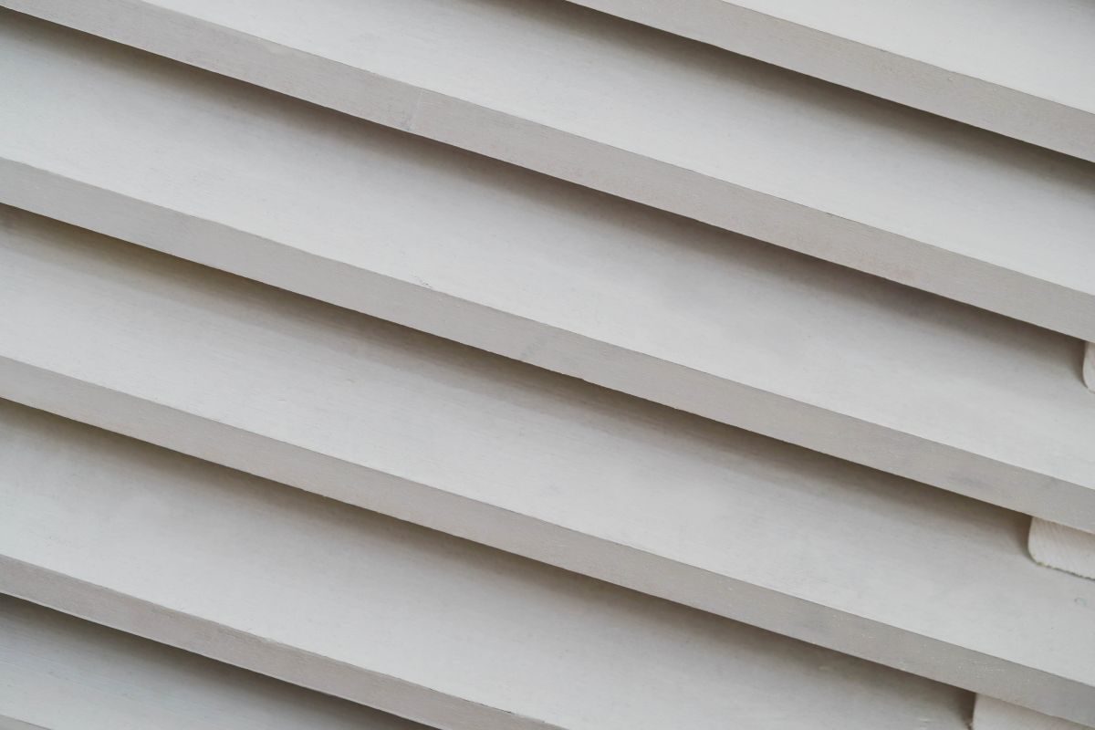 Close-up of beige vinyl lap siding panels