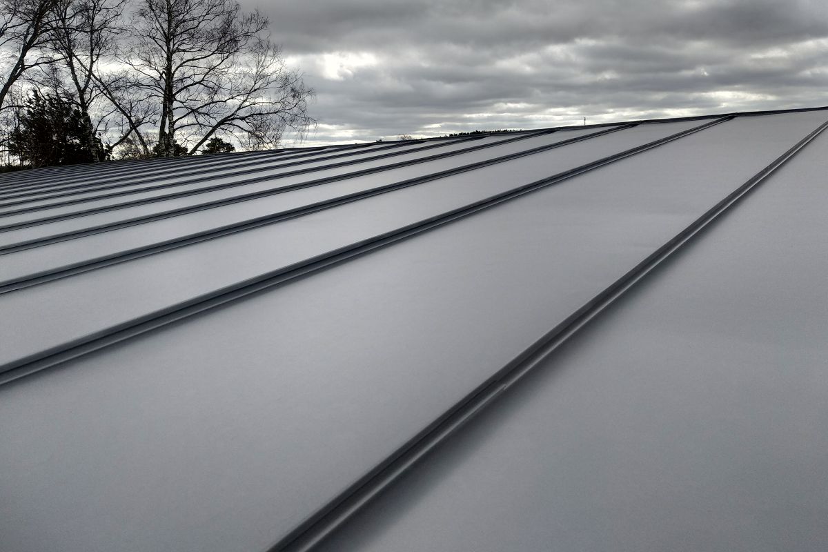 Standing Seam Metal Roof Installation Standing seam metal roof installation on residential home