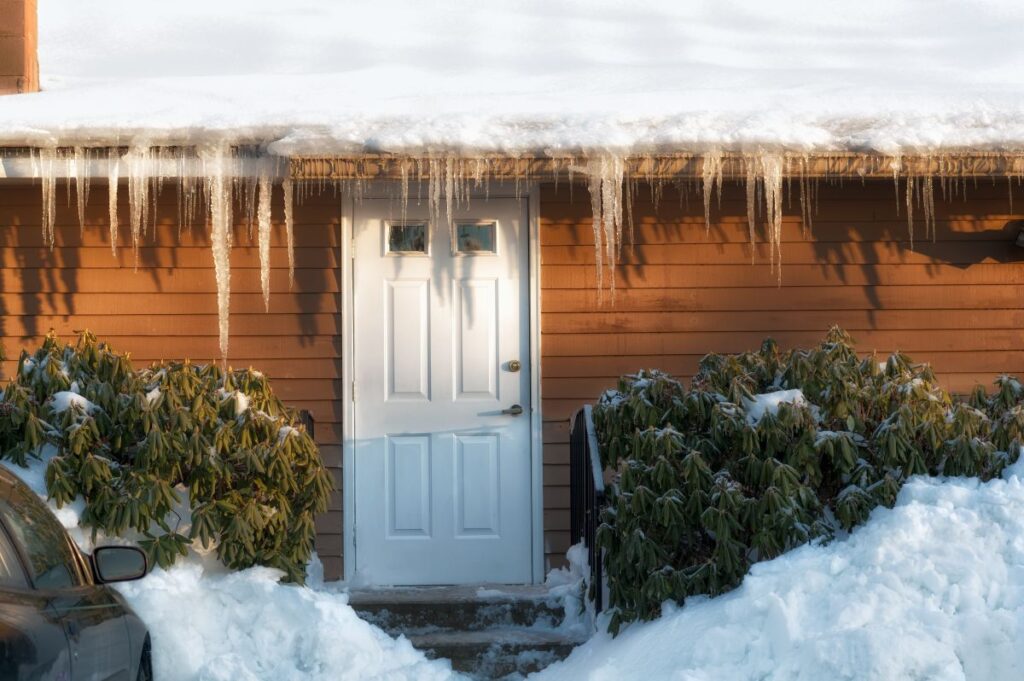 Ice dam forming along roof edge